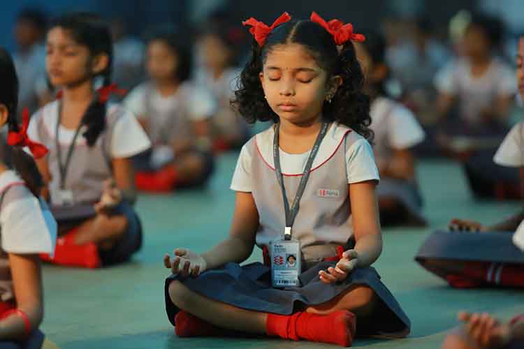 Perks school Students practicing meditation and Yoga